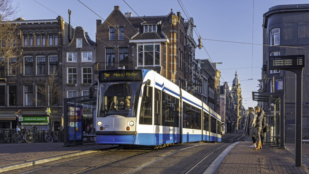 Blue tram in Amsterdam city center