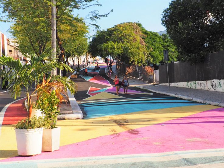 Women walking along colorful street in Fortaleza