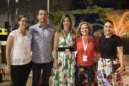 4 women and one man smile at an outdoor reception in Fortaleza, Brazil