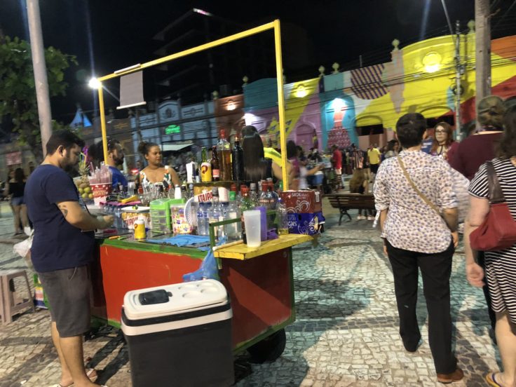 Picture of man selling cocktails outside nightclub in Brazil