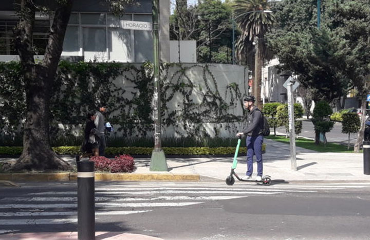Man on electric scooter in Mexico City