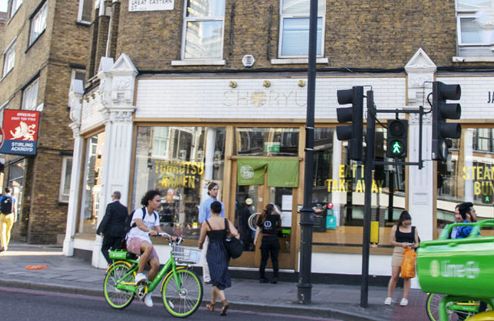 man on bicycle in london street