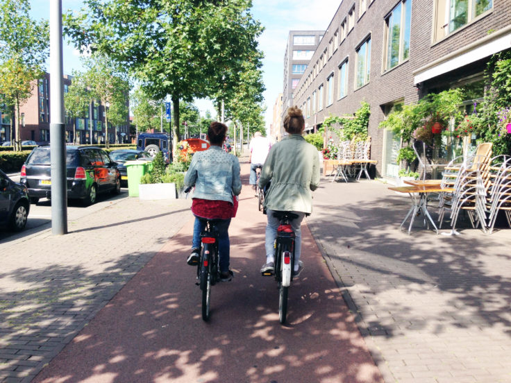 Two women on bicycles in Amsterdam