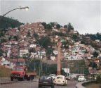 View from highway looking at favela on mountainside