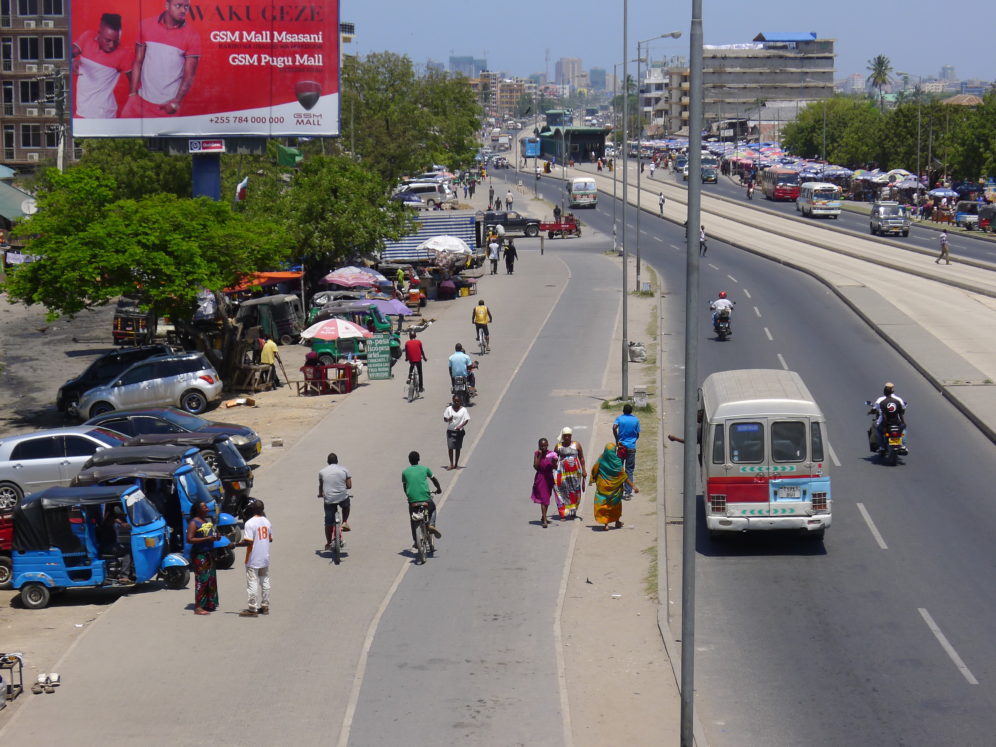 People walking on Dar es Salaam street.